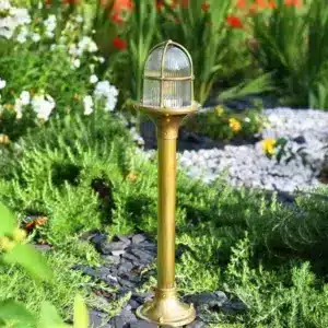 Nautical style brass bollard light with transparent glass for coastal areas