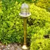 Nautical style brass bollard light with transparent glass for coastal areas