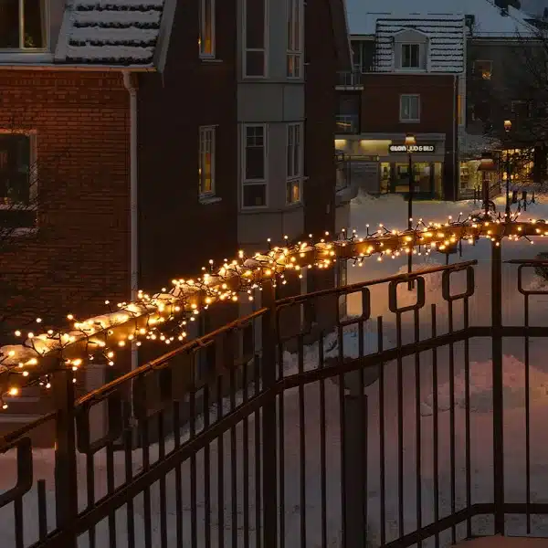 300 low voltage connectable LED cluster Christmas lights in warm white balcony railings display
