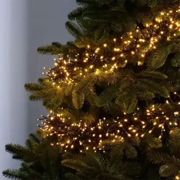 300 low voltage connectable LED cluster Christmas lights in warm white on a tree