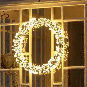 Black metal Christmas wreath with timer function close up window display