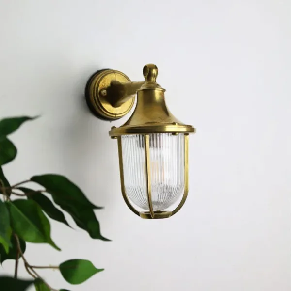 Brass down coastal outdoor wall light unlit front image