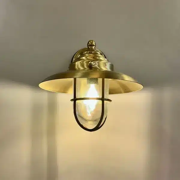Brass oval cage outdoor wall light front view