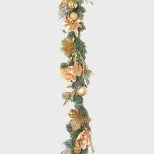 Champagne and magnolia Christmas garland with frosted tips and baubles