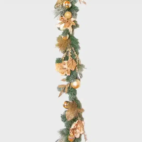 Champagne and magnolia Christmas garland with frosted tips and baubles