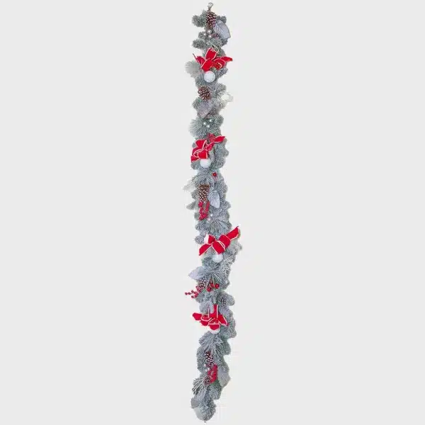 Decorative white frosted Christmas garland with red ribbons and baubles pre decorated