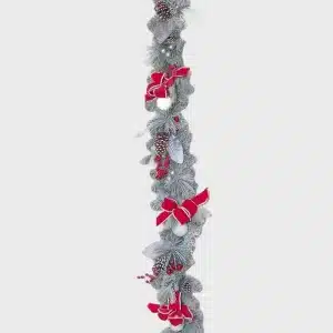 Decorative white frosted Christmas garland with red ribbons and baubles product image