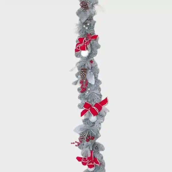 Decorative white frosted Christmas garland with red ribbons and baubles product image