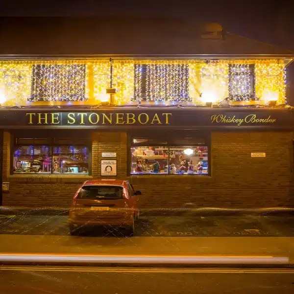 LED connectable curtain Christmas lights 1.5 drop in warm white with ice white flash front angle