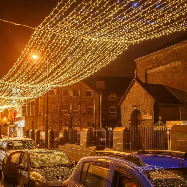 LED curtain lights 10m drop in warm white with ice white flash ceiling display