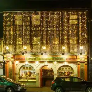 LED curtain lights 10m drop in warm white with ice white flash on a bar building