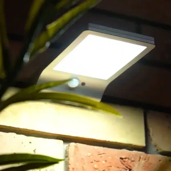 LED solar sensor outdoor wall light illuminated side view