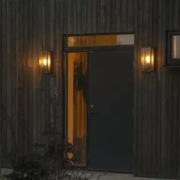 Matt black & brass outdoor wall light outside house