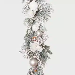 Mixed white bauble frosted Christmas garland close up