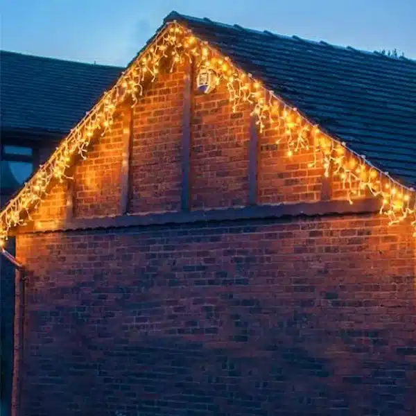Outdoor LED icicle Christmas lights warm white side angle