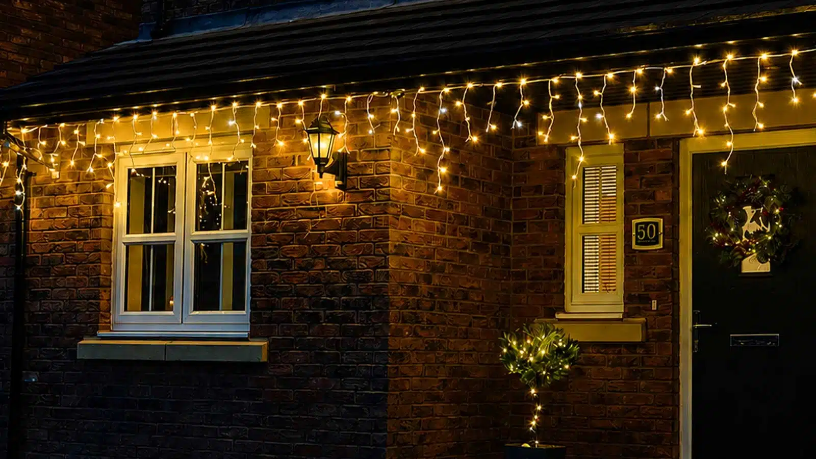 Outdoor LED icicle Christmas lights warm white with ice white flash