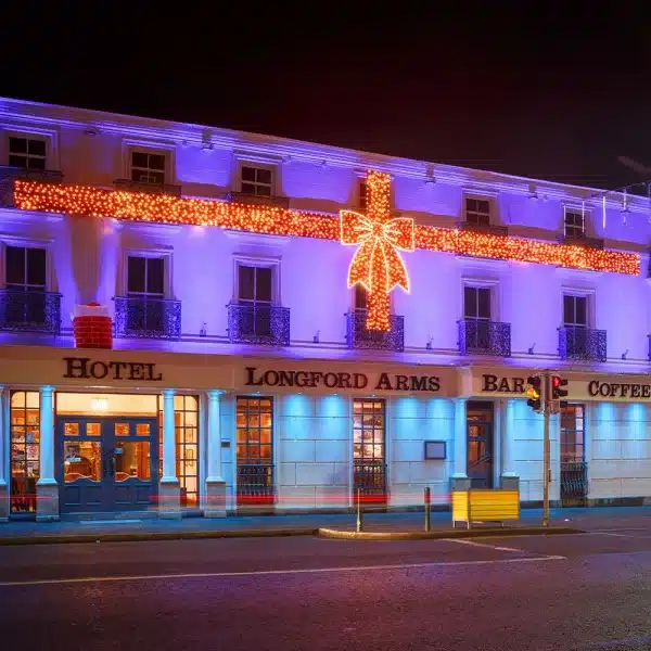 Giant red bow 2D Christmas decoration Longford arms hotel display