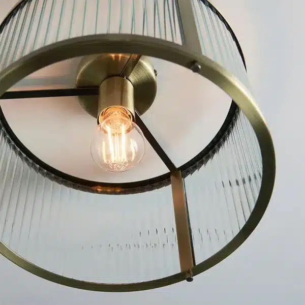 Antique brass flush ceiling pendant light with clear ribbed glass bottom view