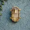Coastal outdoor lighting that withstands the elements in timeless brass & nickel designs