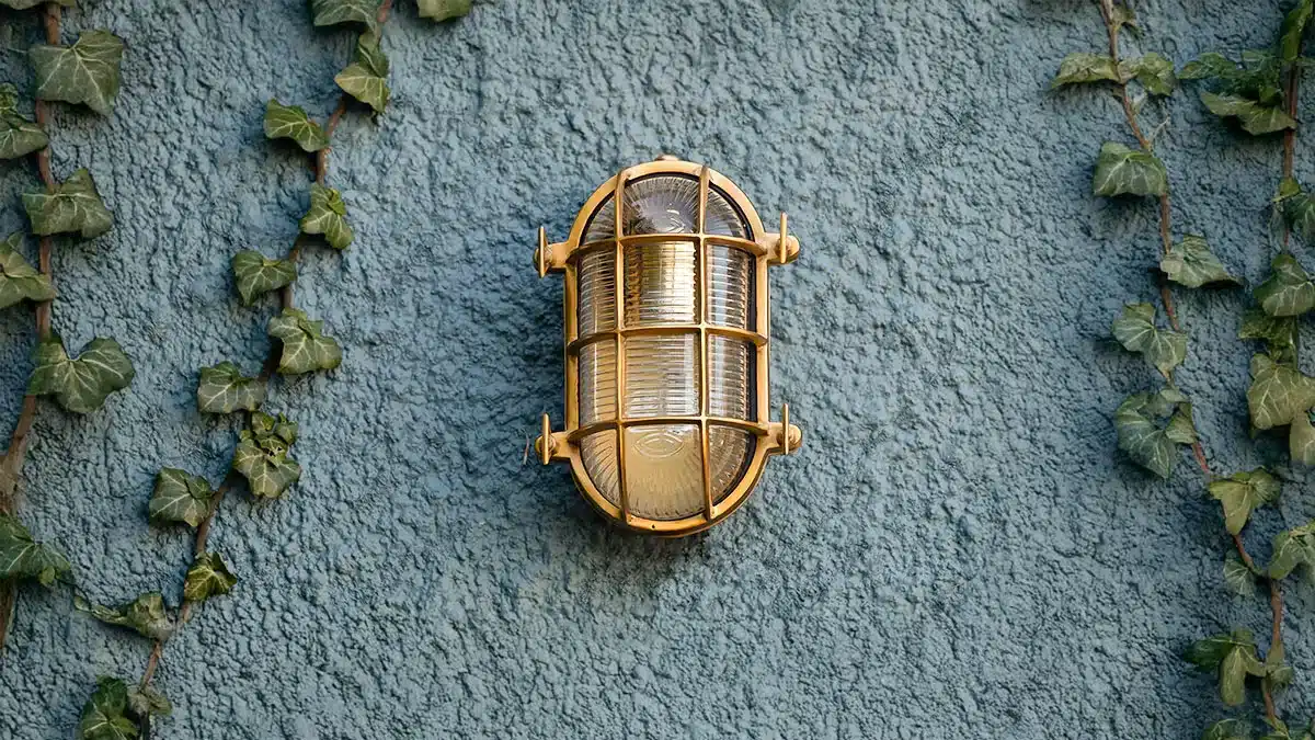Coastal outdoor lighting that withstands the elements in timeless brass & nickel designs