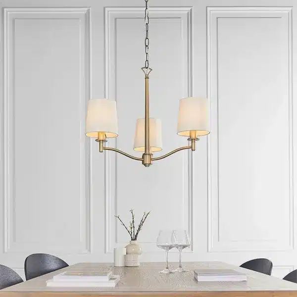 Matt antique brass pendant light with white faux silk shades product view