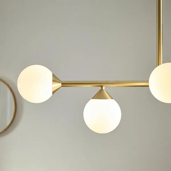 Modern linear bar pendant light in satin brass side view