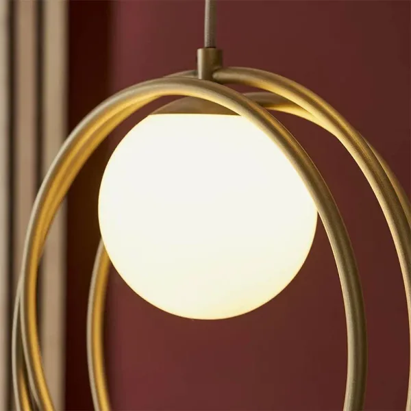 Brushed gold pendant light with opal glass shade detailing