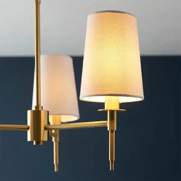 Satin brass pendant light white fabric shades angle