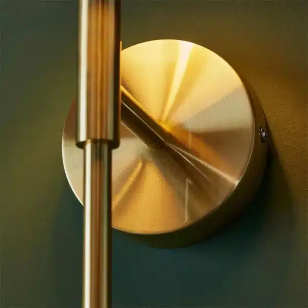 Satin brass wall light round backplate close up