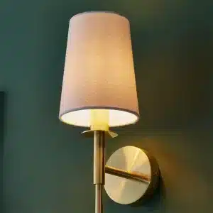 Satin brass wall light with vintage white shade alternative angle