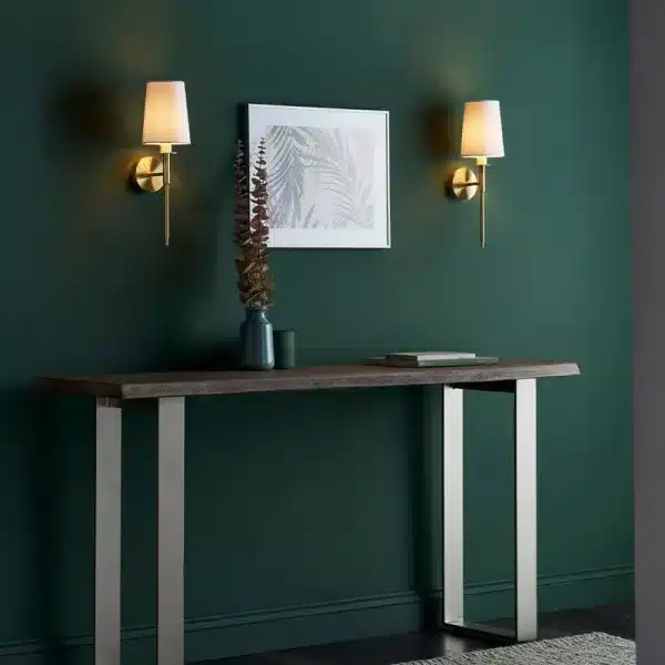 Satin brass wall light pair on wall with painting side look