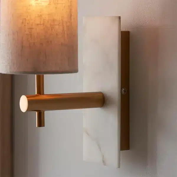 Close up brass and marble effect wall light