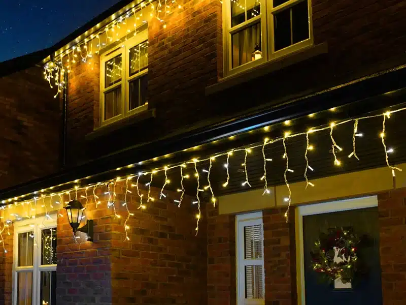 Warm white with ice white flash LED icicle lights ideal for roof edges, gutters and fences