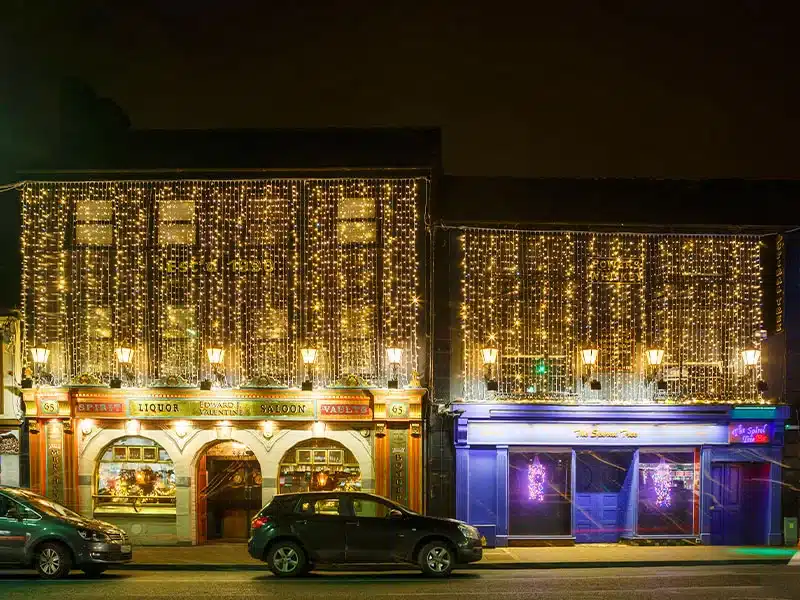 6M outdoor connectable curtain lights warm white with ice white flash ideal for shopfronts, tall walls, wedding venues, pubs and bars
