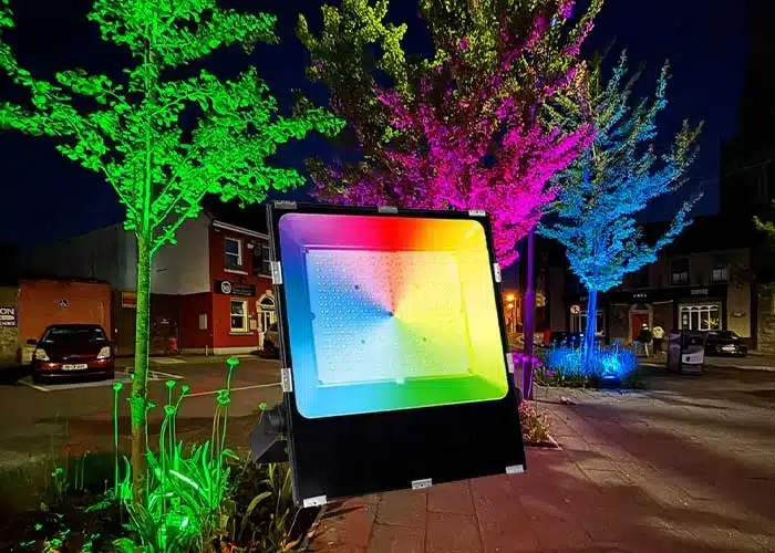Garden illuminated with colourful smart lighting