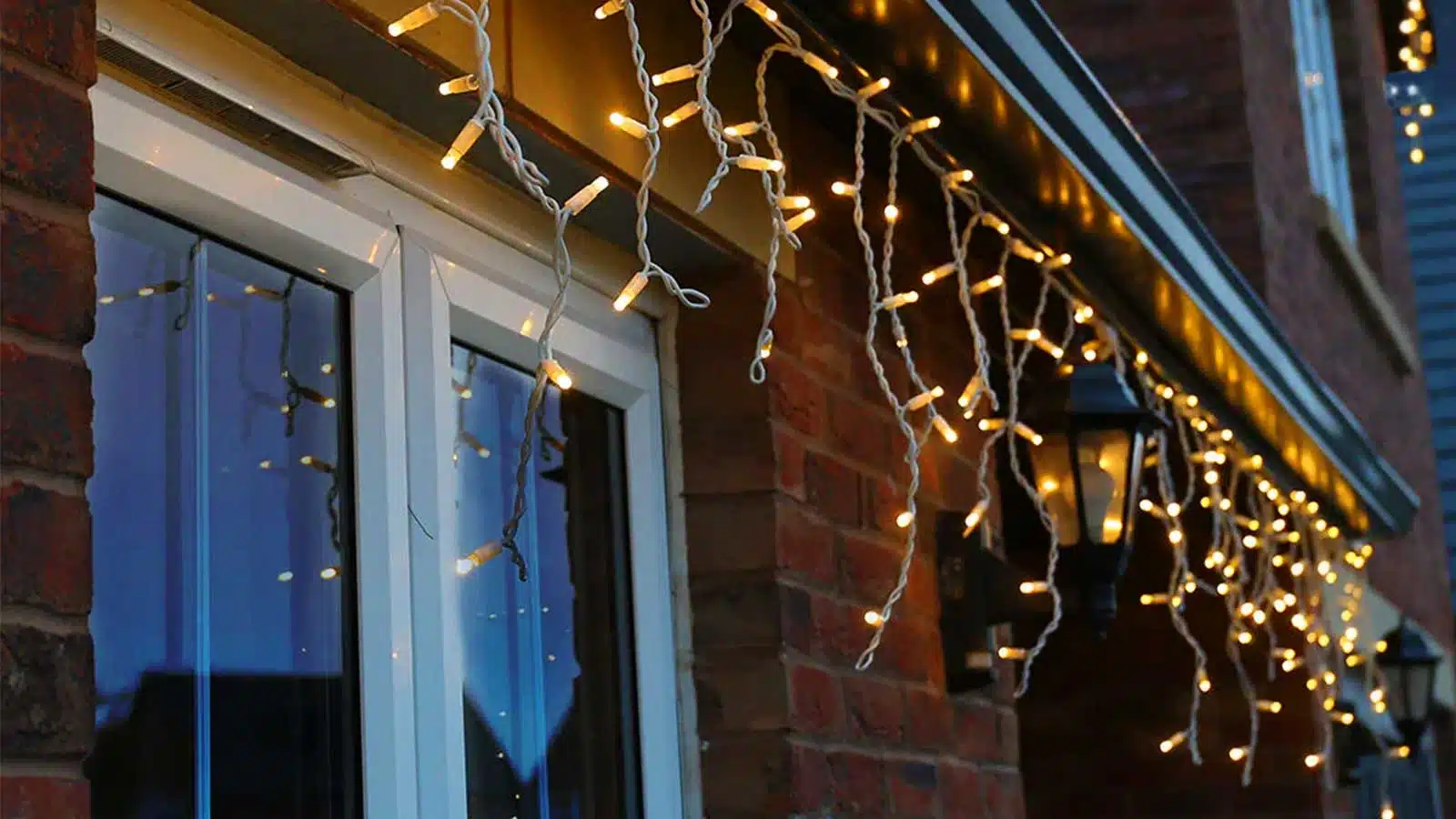 Outdoor LED Icicle Christmas Lights Warm White in a Christmas display