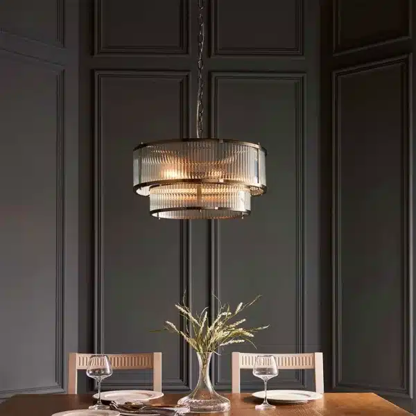 Endon 110944 Ridgeton 5 light tiered antique brass pendant light above dining table