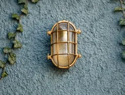 Coastal outdoor lighting that withstands the elements in timeless brass & nickel designs